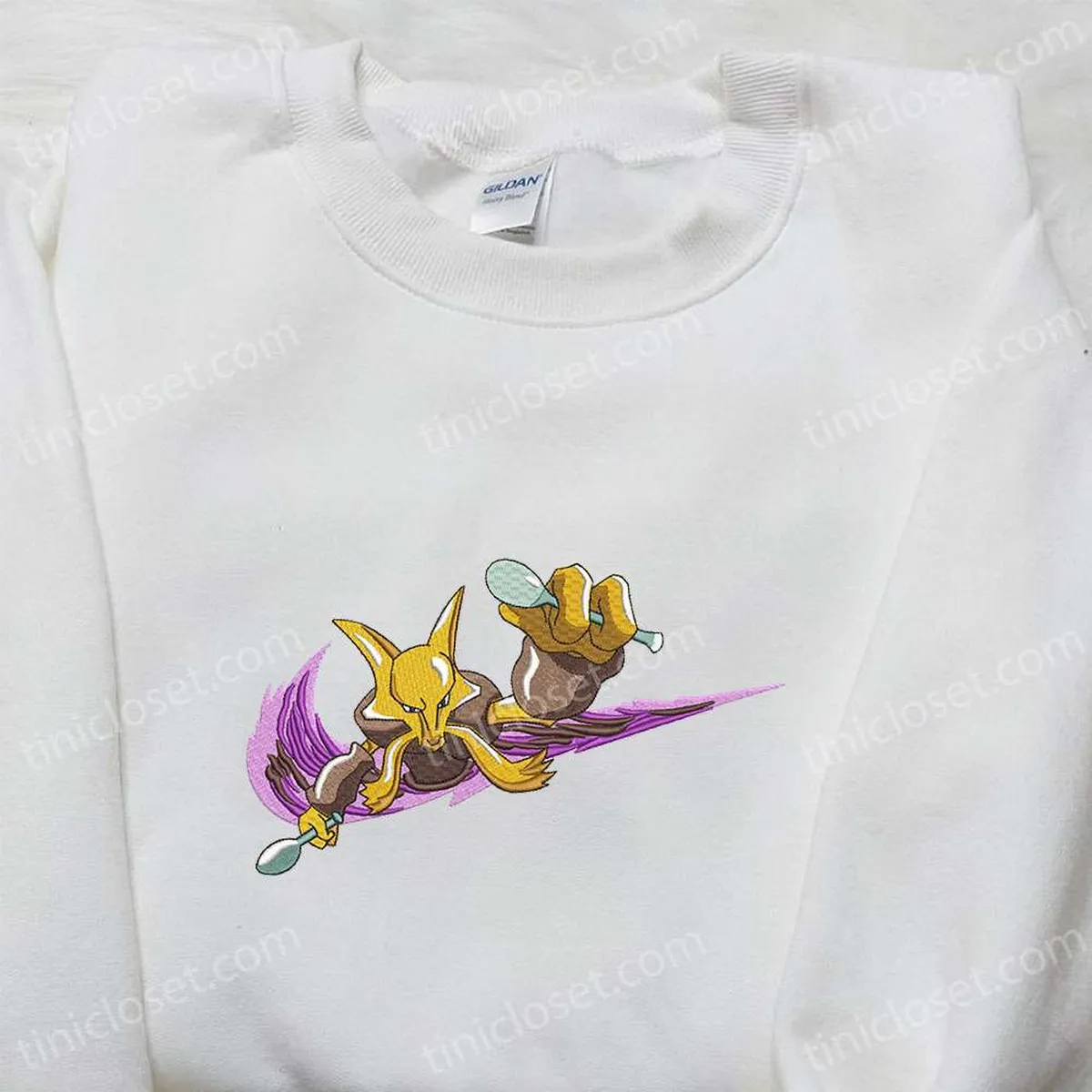 alakazam-x-nike-swoosh-anime-embroidered-shirt-pokemon-embroidered-shirt-nike-inspired-embroidered-shirt-tjdxz.webp